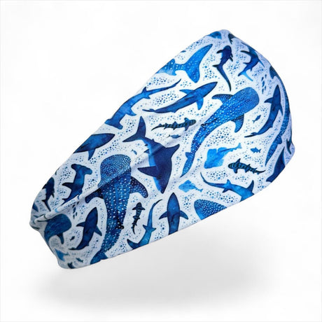 Blue shark patterned headband on a white background