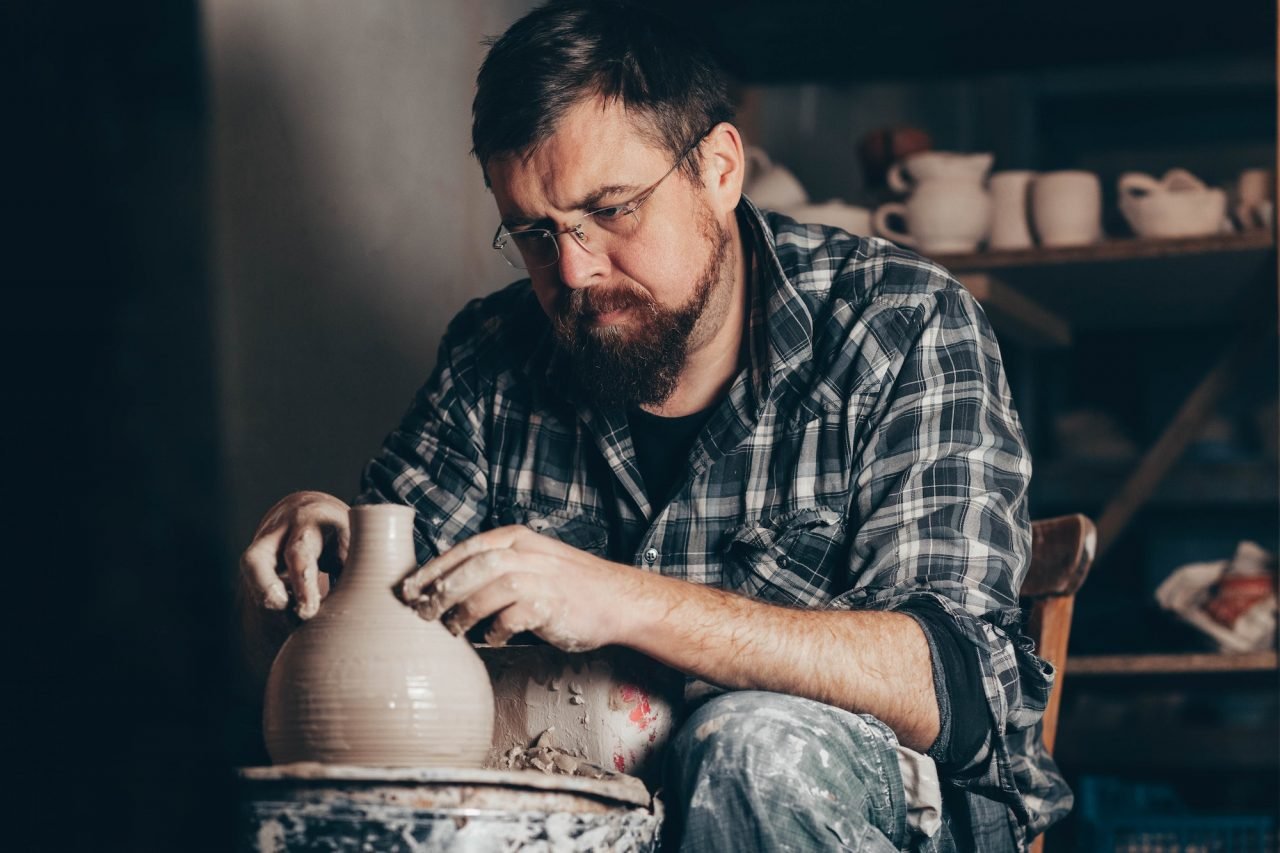 Master Works On The Potter S Wheel Creating A Jug Of Clay.jpg